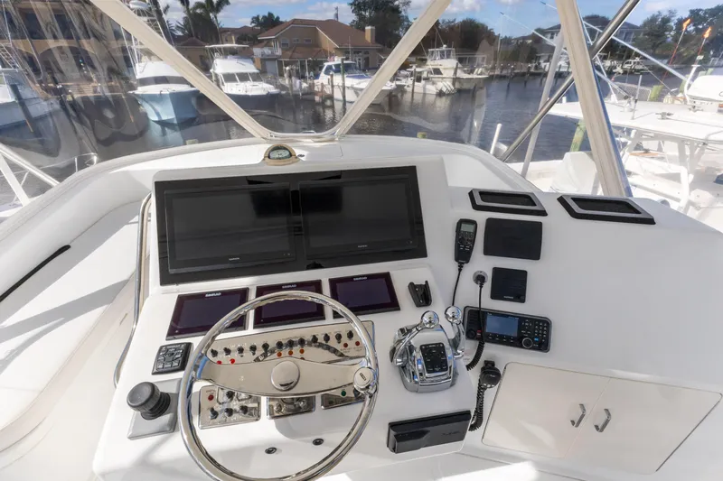Well Played Yacht Photos Pics Helm of 2011 Cabo 40 Flybridge with advanced navigation equipment and controls.