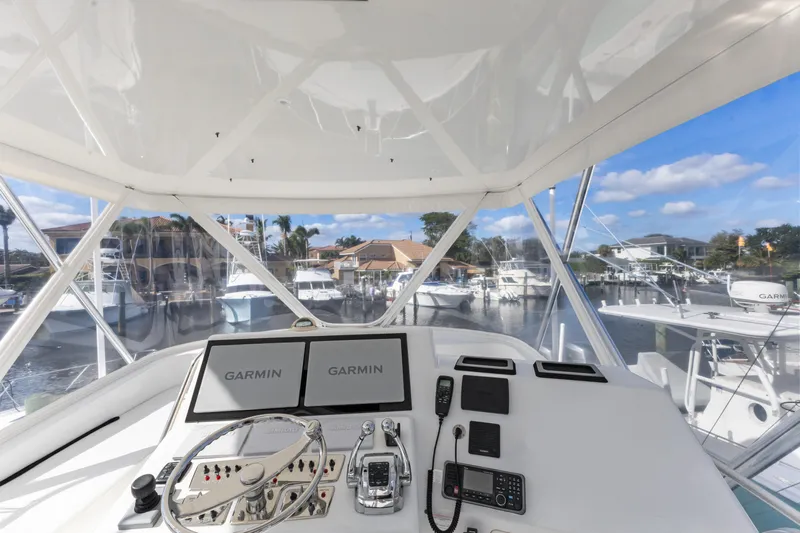 Well Played Yacht Photos Pics Cabo 40 Flybridge 2011 helm with Garmin displays, marina view.