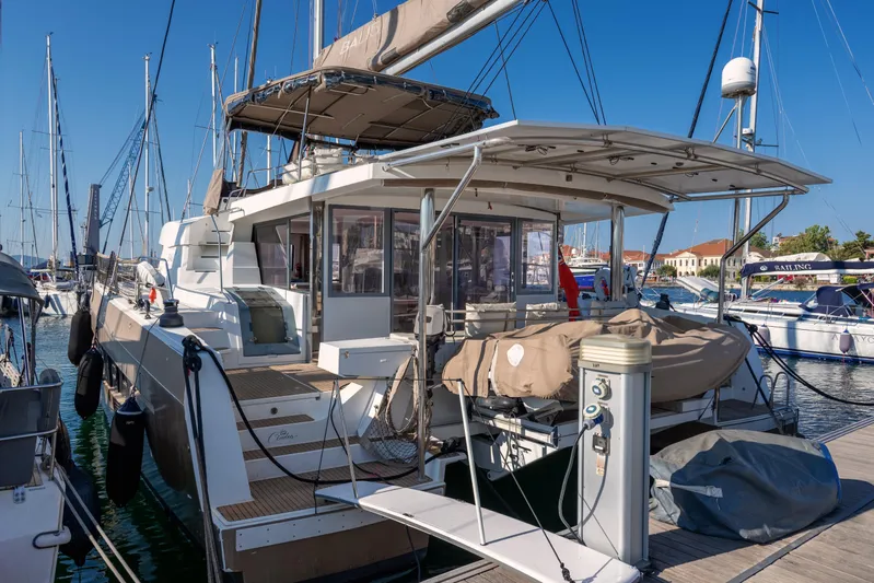 Cinders Yacht Photos Pics 2020 Bali 5.4 catamaran docked at marina, featuring spacious deck and modern design.