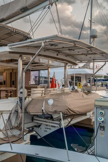 Cinders Yacht Photos Pics Luxury Bali 5.4 catamaran yacht docked at marina, 2020 model, with covered equipment.