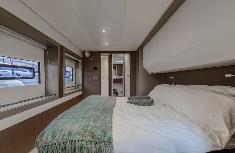 Cinders Yacht Photos Pics Luxurious bedroom interior on a 2020 Bali 5.4 yacht with cozy bedding.