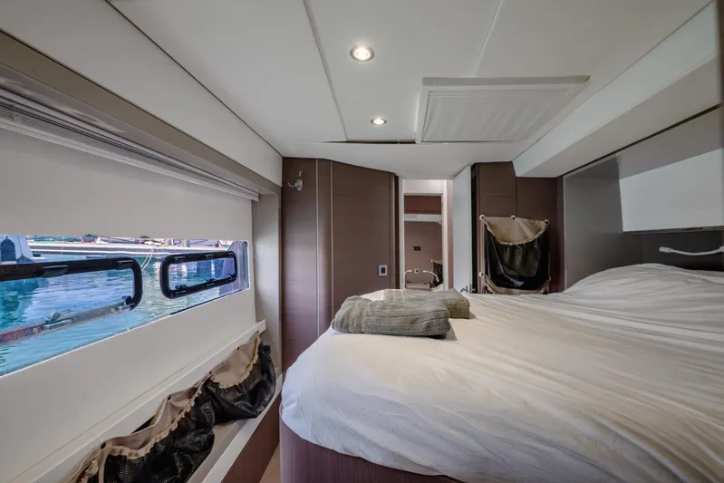 Cinders Yacht Photos Pics Luxurious cabin interior of 2020 Bali 5.4 yacht with cozy bed and ocean view.