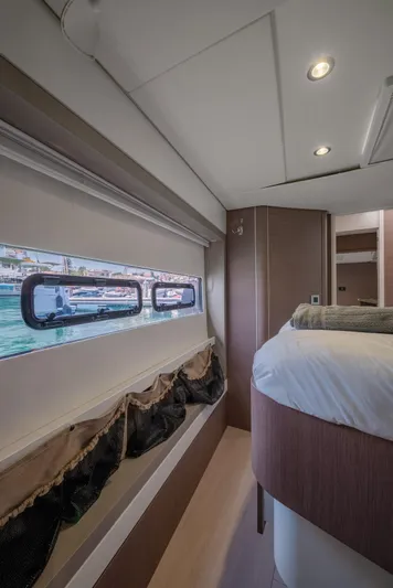 Cinders Yacht Photos Pics Luxurious interior cabin of a 2020 Bali 5.4 yacht with scenic window view.