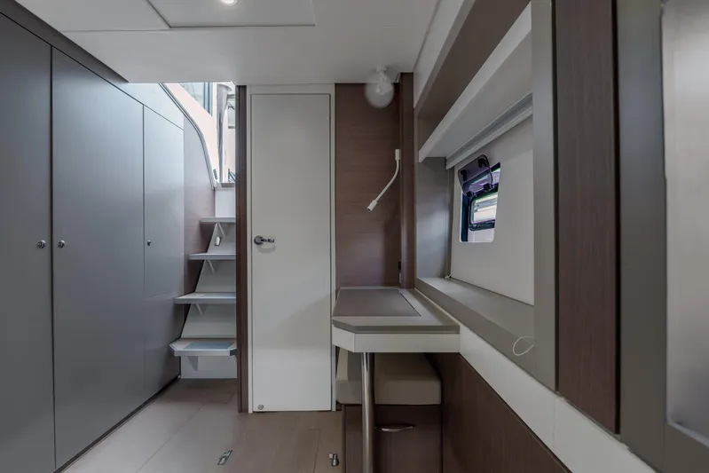 Cinders Yacht Photos Pics Modern interior of 2020 Bali 5.4 yacht with sleek design and compact staircase.