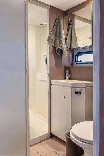 Cinders Yacht Photos Pics Modern bathroom in 2020 Bali 5.4 yacht with sink, toilet, and shower.