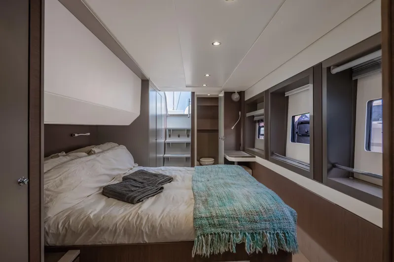 Cinders Yacht Photos Pics Luxurious bedroom interior of 2020 Bali 5.4 yacht with cozy bed and modern design.