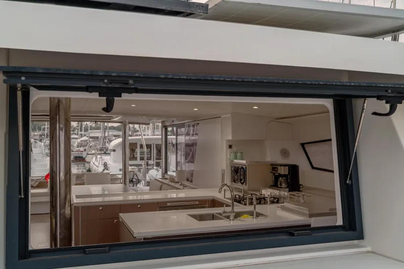 Cinders Yacht Photos Pics Modern kitchen interior on a 2020 Bali 5.4 yacht, featuring sleek design and appliances.