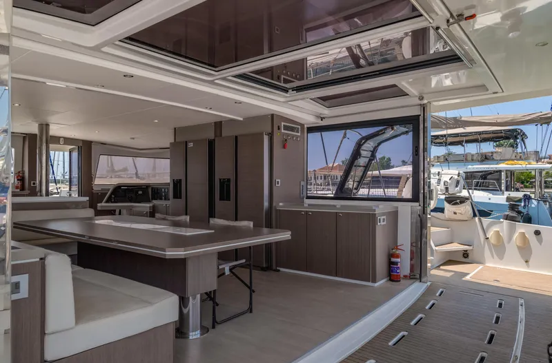 Cinders Yacht Photos Pics Luxurious interior of a 2020 Bali 5.4 catamaran with modern furnishings and open layout.