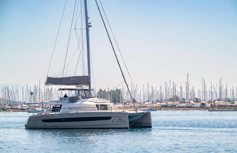 Cinders Yacht Photos Pics Sailing catamaran Bali 5.4, 2020 model, anchored in a marina with numerous masts.