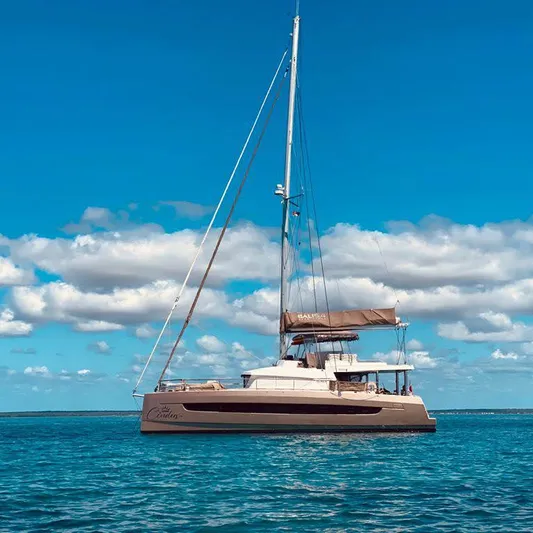 Cinders Yacht Photos Pics Sailing catamaran Bali 5.4, 2020 model, on calm ocean under blue sky.