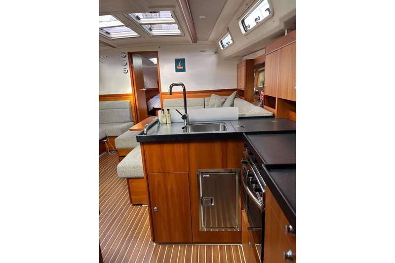  Yacht Photos Pics Interior of 2017 Hanse 455 yacht with modern kitchen and cozy seating area.
