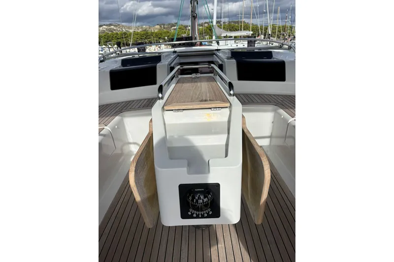  Yacht Photos Pics 2017 Hanse 455 yacht cockpit with wooden flooring and modern navigation equipment.