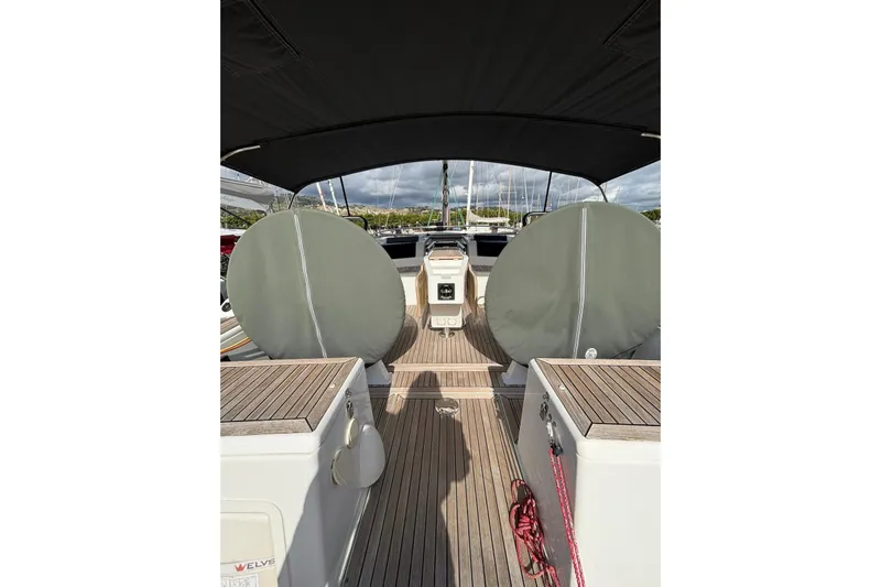 Yacht Photos Pics 2017 Hanse 455 yacht cockpit with covered steering wheels and teak flooring.