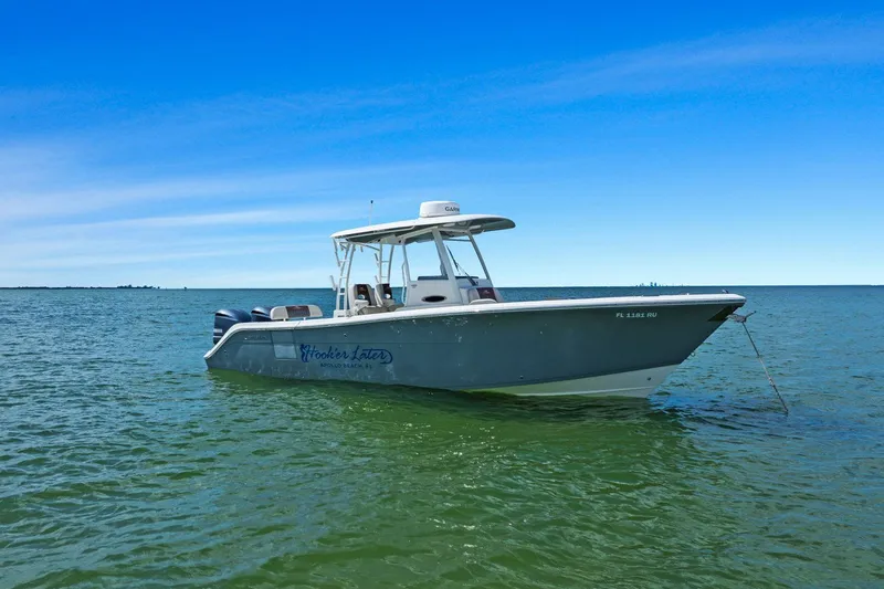  Yacht Photos Pics 2019 Cobia 301 Center Console boat on calm waters.