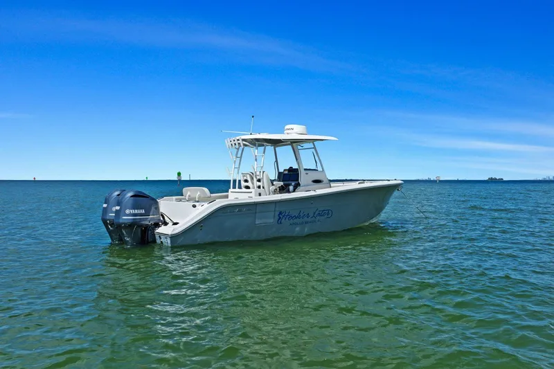  Yacht Photos Pics 2019 Cobia 301 Center Console on calm waters.
