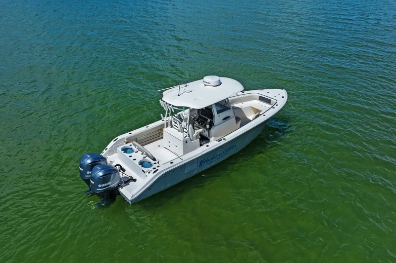  Yacht Photos Pics 2019 Cobia 301 Center Console on calm water.