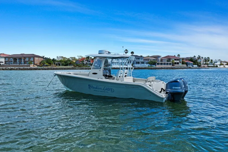  Yacht Photos Pics 2019 Cobia 301 Center Console boat on calm water.