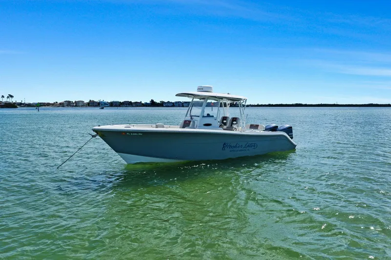  Yacht Photos Pics 2019 Cobia 301 Center Console boat on calm water.