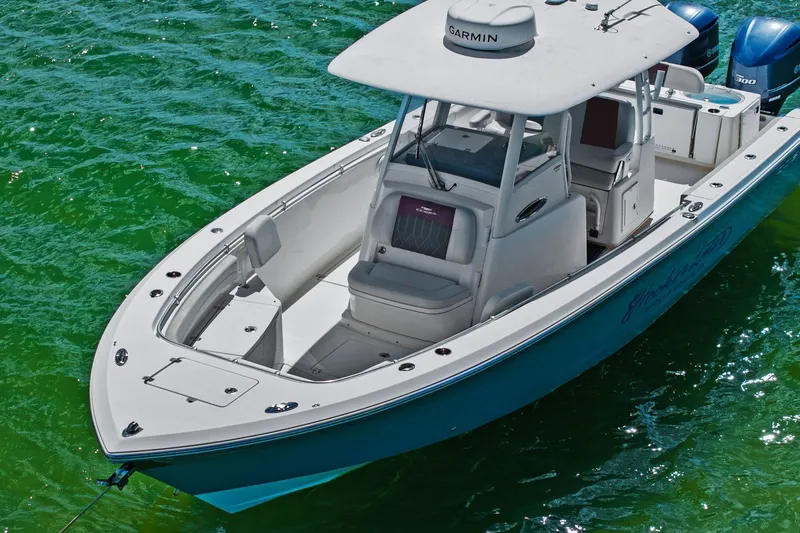  Yacht Photos Pics 2019 Cobia 301 Center Console on green water.