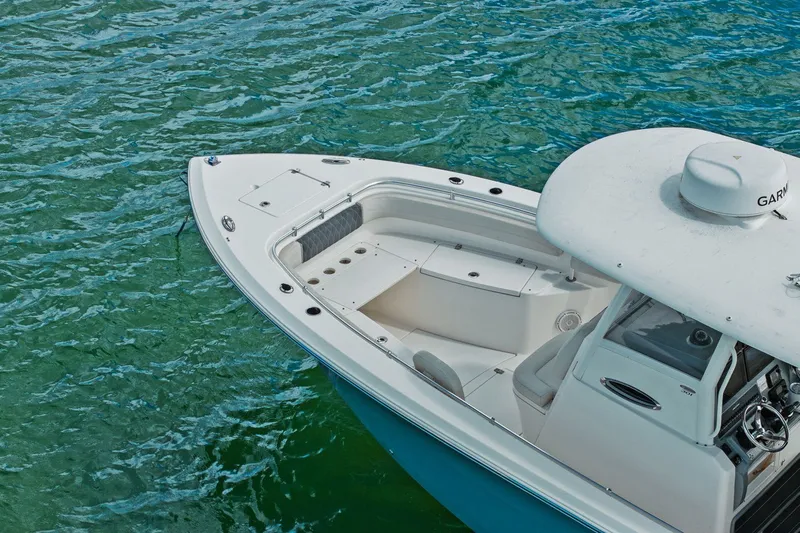  Yacht Photos Pics 2019 Cobia 301 Center Console on calm water.