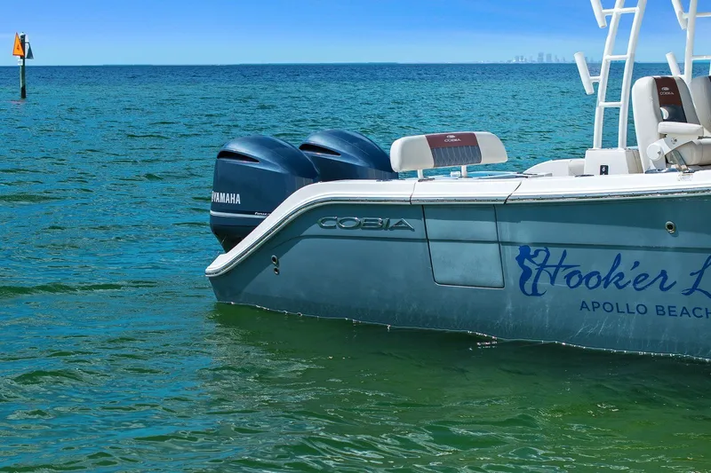  Yacht Photos Pics Cobia 301 Center Console boat on the sea, 2019 model.