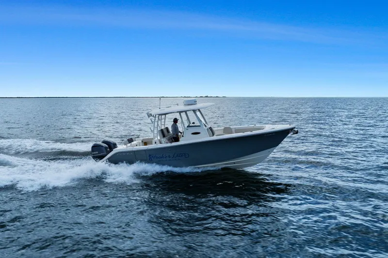  Yacht Photos Pics 2019 Cobia 301 Center Console boat on open sea.