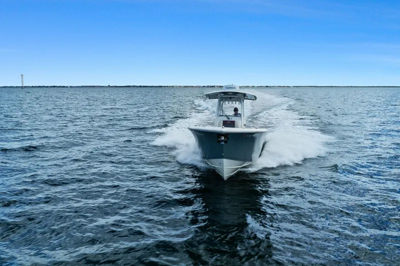  Yacht Photos Pics 2019 Cobia 301 Center Console cruising on open water.