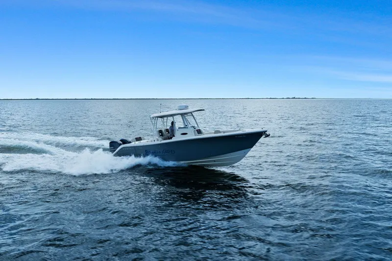  Yacht Photos Pics 2019 Cobia 301 Center Console boat on open sea.