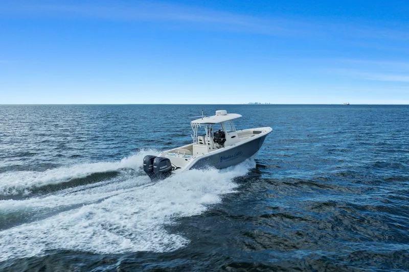  Yacht Photos Pics 2019 Cobia 301 Center Console cruising on open sea.