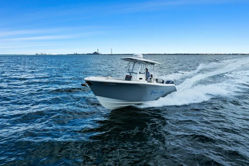  Yacht Photos Pics 2019 Cobia 301 Center Console cruising on open water.