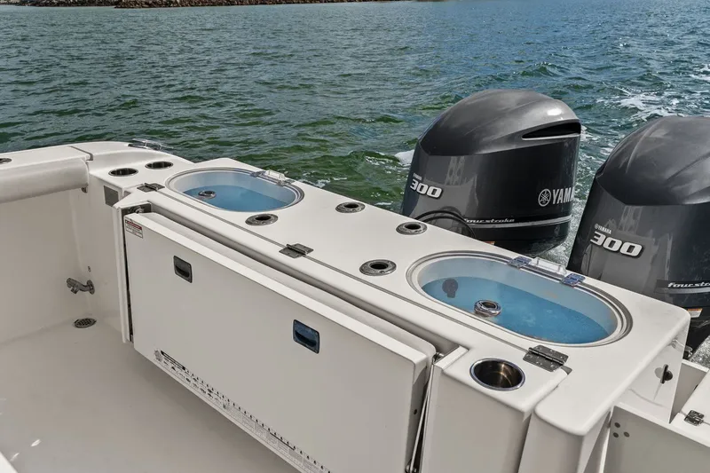  Yacht Photos Pics 2019 Cobia 301 Center Console with Yamaha engines on the water.