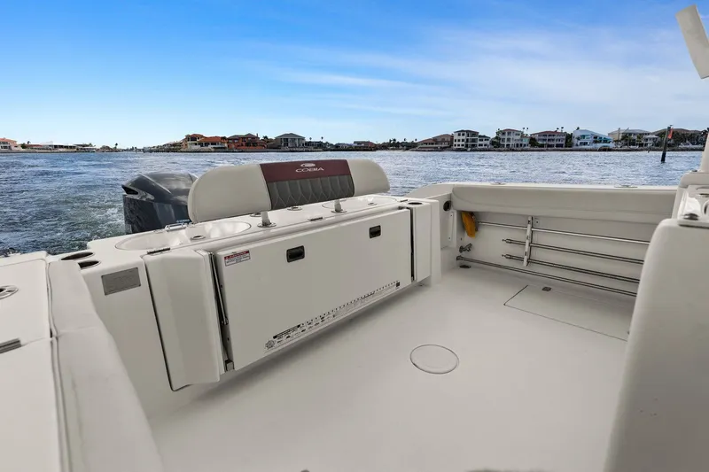  Yacht Photos Pics Cobia 301 Center Console 2019 on calm waters with coastal view.