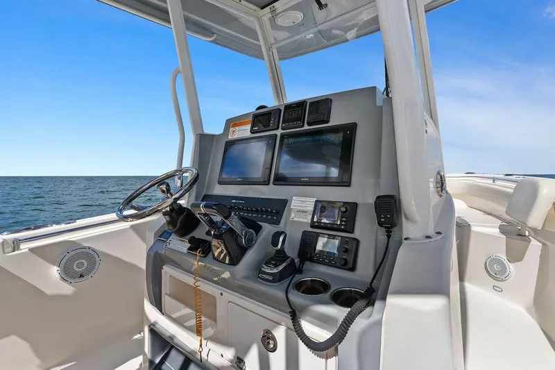  Yacht Photos Pics Cobia 301 Center Console 2019 helm with electronics on open sea.