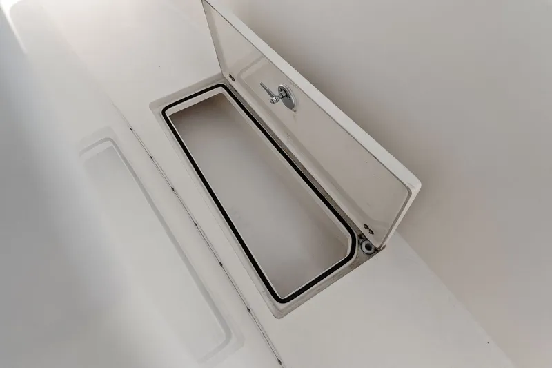  Yacht Photos Pics Open storage compartment on a 2019 Cobia 301 Center Console boat.