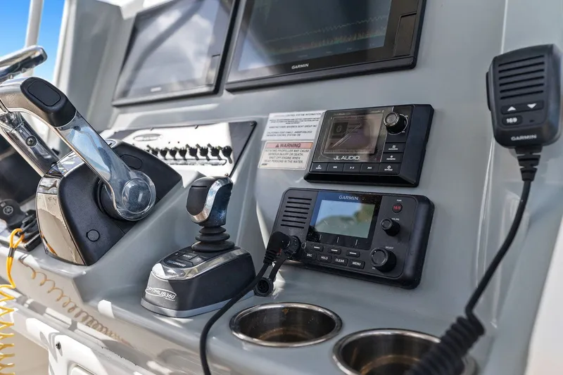  Yacht Photos Pics Cobia 301 Center Console 2019 helm with Garmin and JL Audio equipment.