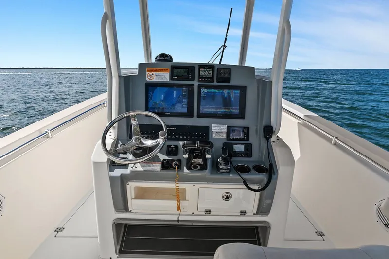  Yacht Photos Pics Cobia 301 Center Console 2019 helm on open sea.