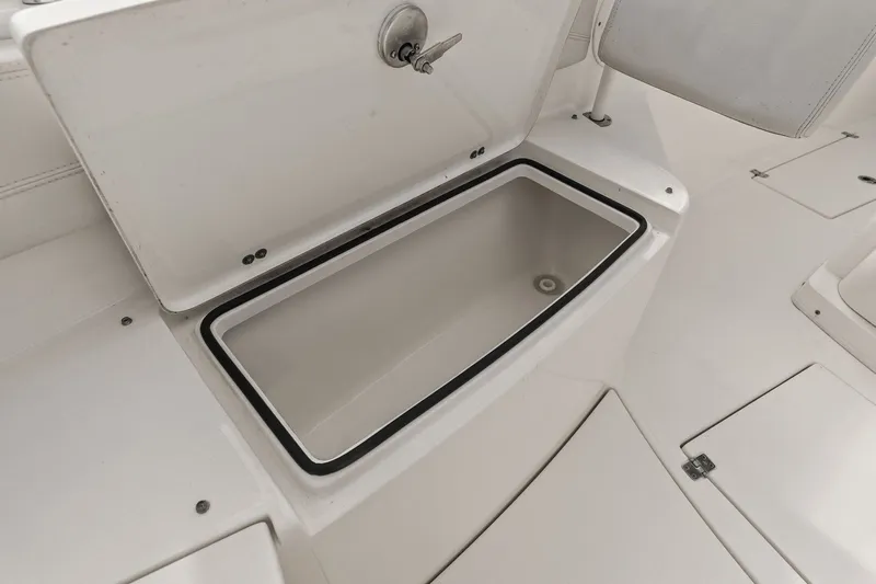  Yacht Photos Pics Open storage compartment on a 2019 Cobia 301 Center Console boat.