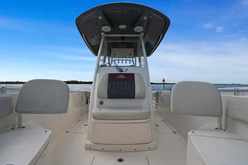  Yacht Photos Pics Cobia 301 Center Console boat, 2019, on calm waters.