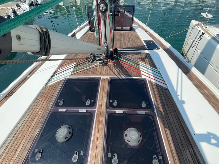  Yacht Photos Pics Deck view of 2017 Hanse 455 sailboat with wooden finish and rigging details.