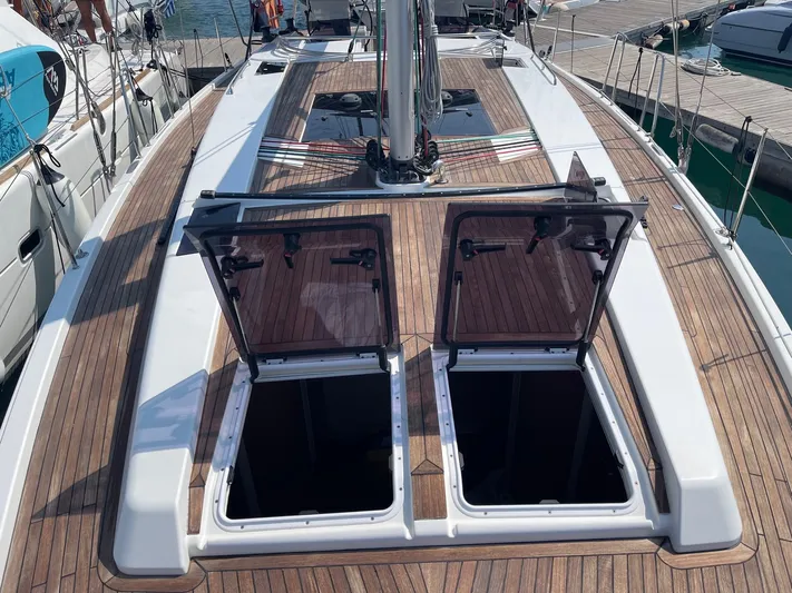 Yacht Photos Pics 2017 Hanse 455 yacht deck with open hatches, showcasing sleek design and wood finish.