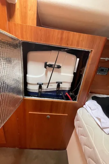  Yacht Photos Pics Hanse 455 (2017) yacht interior showing storage compartment with white tank.