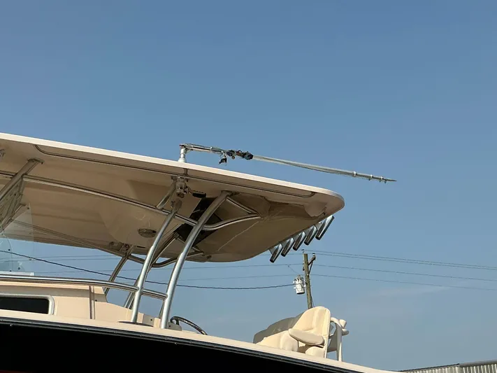 H Lady Frances Yacht Photos Pics 2011 Grady-White Canyon 336 boat with fishing rod holders under a clear blue sky.