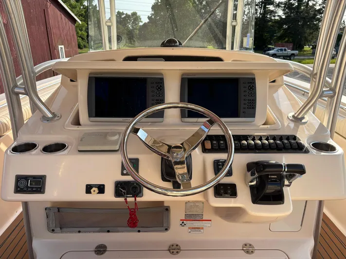 H Lady Frances Yacht Photos Pics 2011 Grady-White Canyon 336 helm with dual displays and steering wheel.