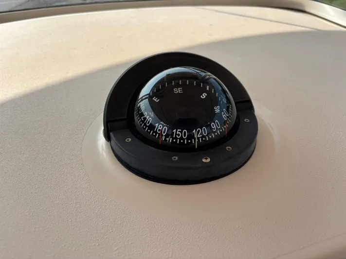 H Lady Frances Yacht Photos Pics Compass on 2011 Grady-White Canyon 336 boat dashboard, showing southeast direction.