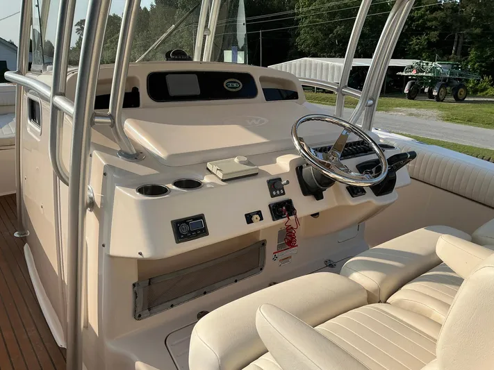 H Lady Frances Yacht Photos Pics 2011 Grady-White Canyon 336 boat helm with steering wheel and controls.