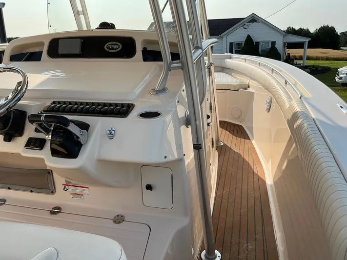 H Lady Frances Yacht Photos Pics 2011 Grady-White Canyon 336 boat interior with helm, controls, and wooden deck.