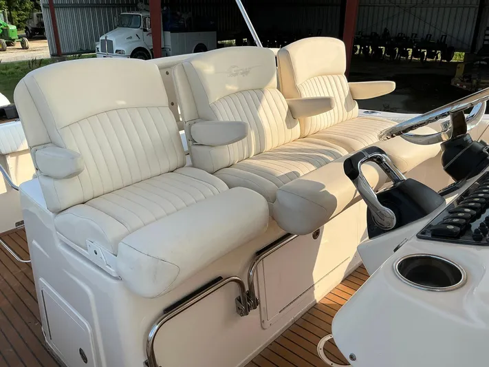 H Lady Frances Yacht Photos Pics 2011 Grady-White Canyon 336 boat with plush white seating and control panel.