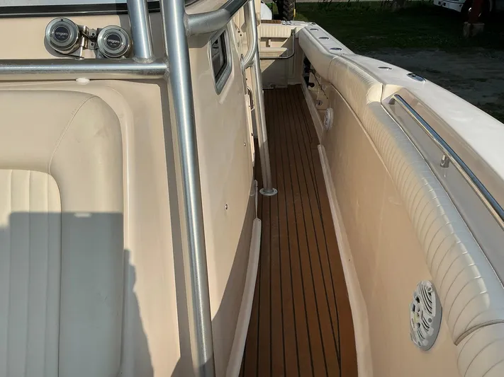 H Lady Frances Yacht Photos Pics 2011 Grady-White Canyon 336 boat interior with teak flooring and cushioned seating.
