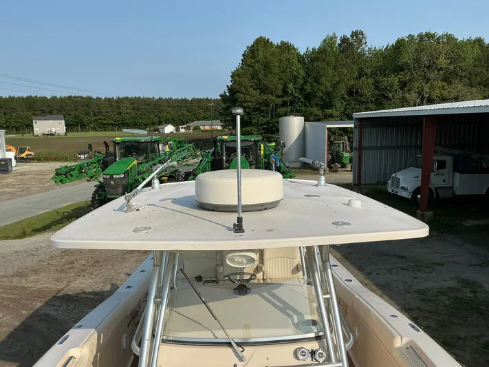 H Lady Frances Yacht Photos Pics 2011 Grady-White Canyon 336 boat in a rural setting with farm equipment.
