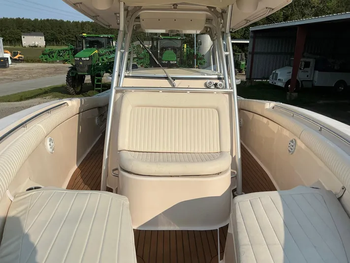 H Lady Frances Yacht Photos Pics 2011 Grady-White Canyon 336 boat interior with cushioned seating and wood flooring.